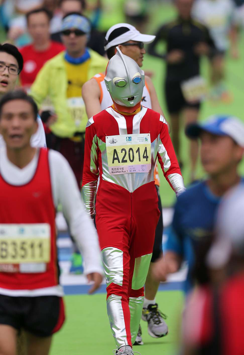 A runner dresses as Ultraman in action. Photo: SCMP