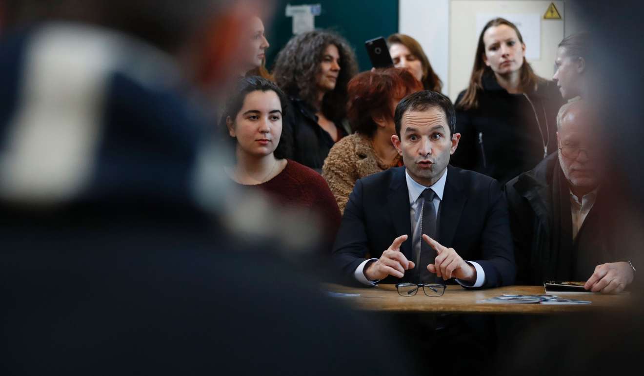 French presidential candidate Benoit Hamon speaks to members of the Fabrique de la Culture, an artist platform, during a visit in Arcueil, outside Paris. Hamon has made universal basic income a central plank of his campaign. Photo: AFP