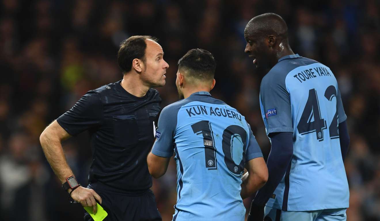 Manchester City’s Sergio Aguero and Yaya Toure remonstrate with the referee after Aguero was yellow-carded for diving. Photo: AFP