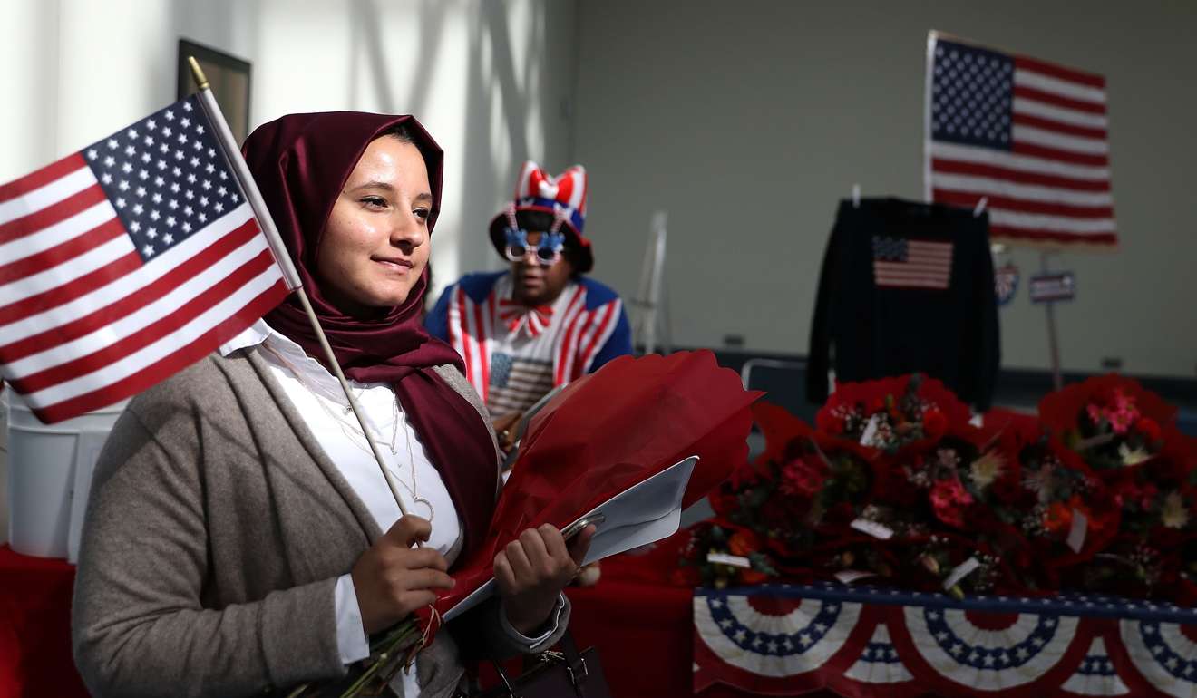 A new US citizen leaves a naturalisation ceremony at the Los Angeles Convention Centre last week. Photo: AFP