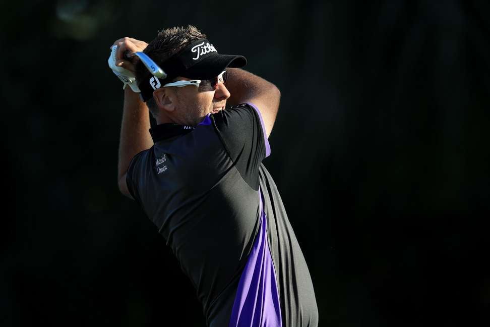 England’s Ian Poulter plays his shot from the 7th tee during the first round. Photo: AFP