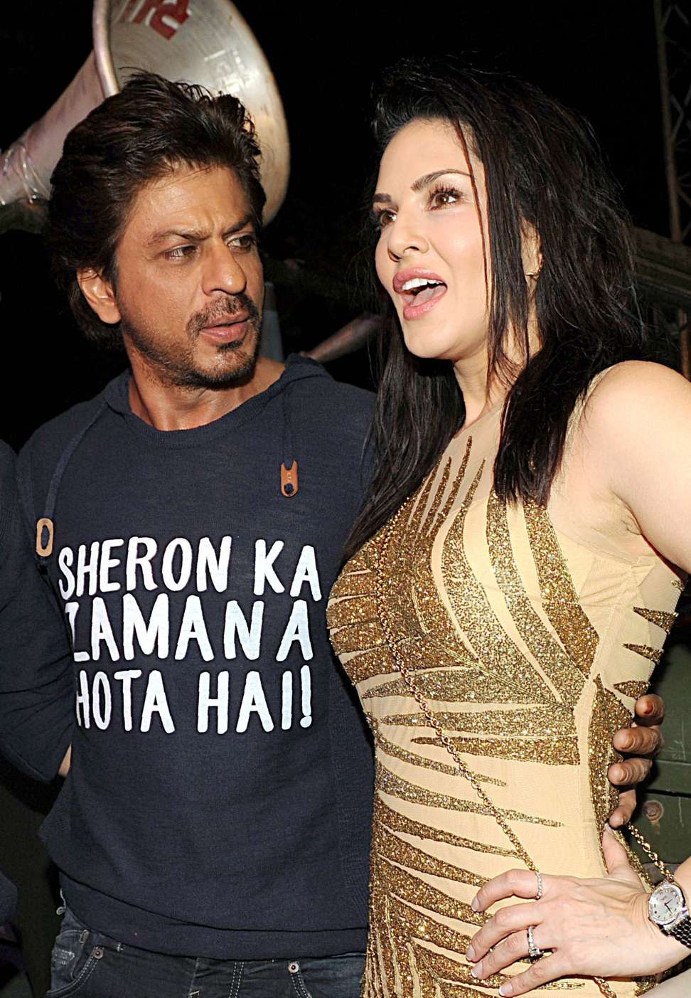 Indian Bollywood actors Shah Rukh Khan, left, and Sunny Leone promote their film Raees in Mumbai. Photo: AFP