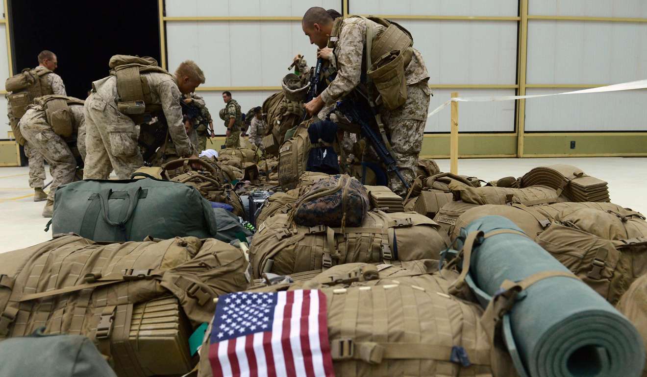 This October 26, 2014 file photo shows US Marines arranging their equipment as US troops arrive in Kandahar after their withdrawal from the Camp Bastion-Leatherneck complex in Helmand province. Photo: AFP