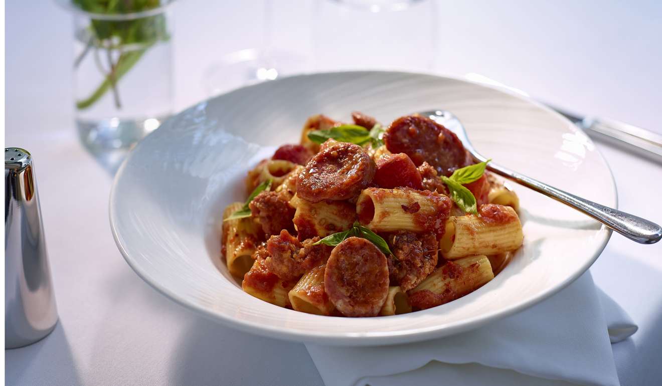 Rigatoni with Tuscan sausage in spicy tomato sauce, sprinkled with Parmesan