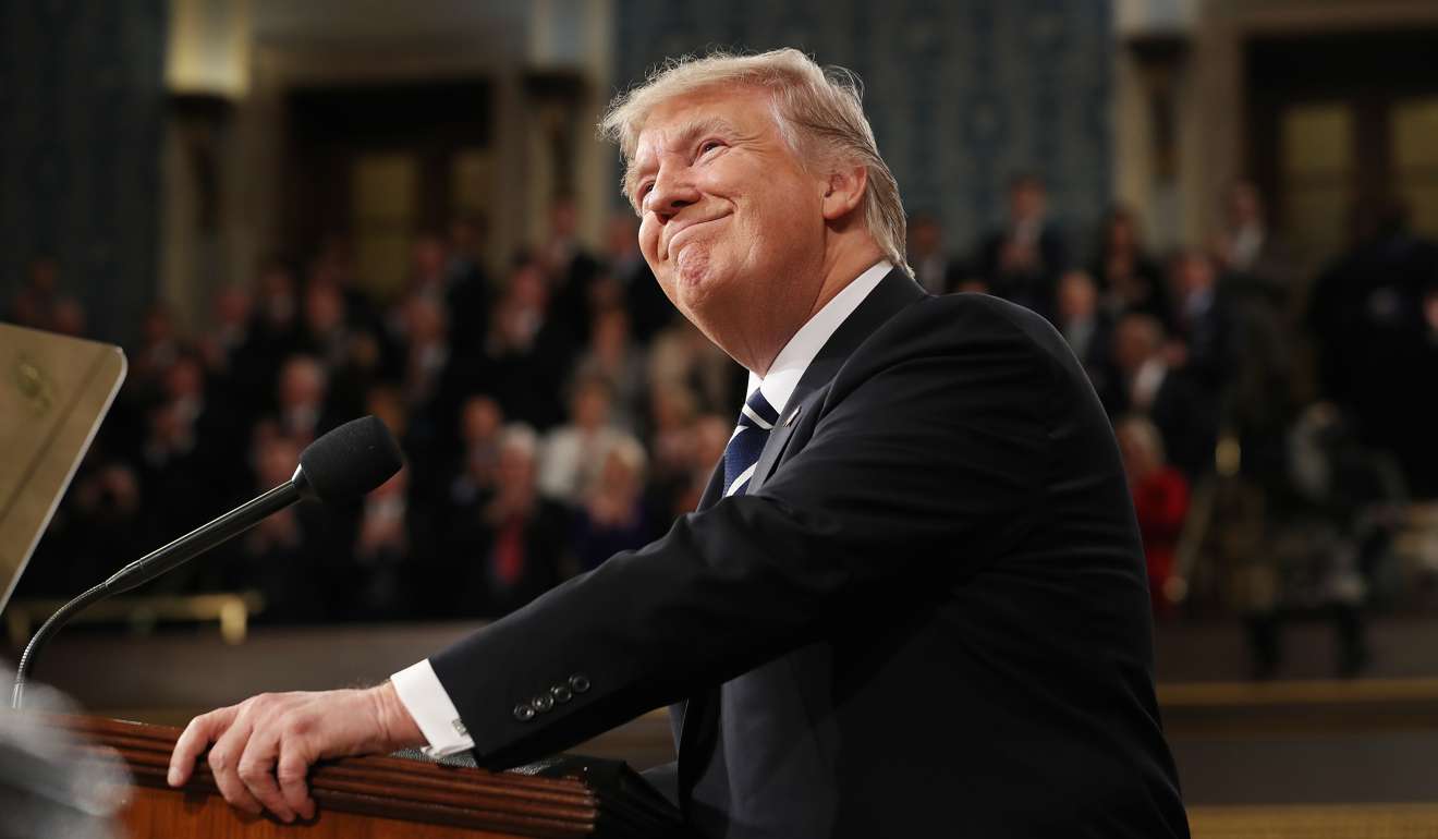 Trump smiles before speaking. Photo: Bloomberg