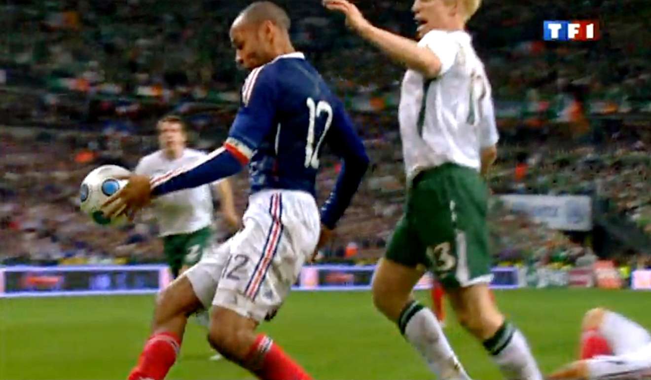 A TV grab shows French forward Thierry Henry (left) appearing to handle the ball against Ireland in 2009. Photo: AFP