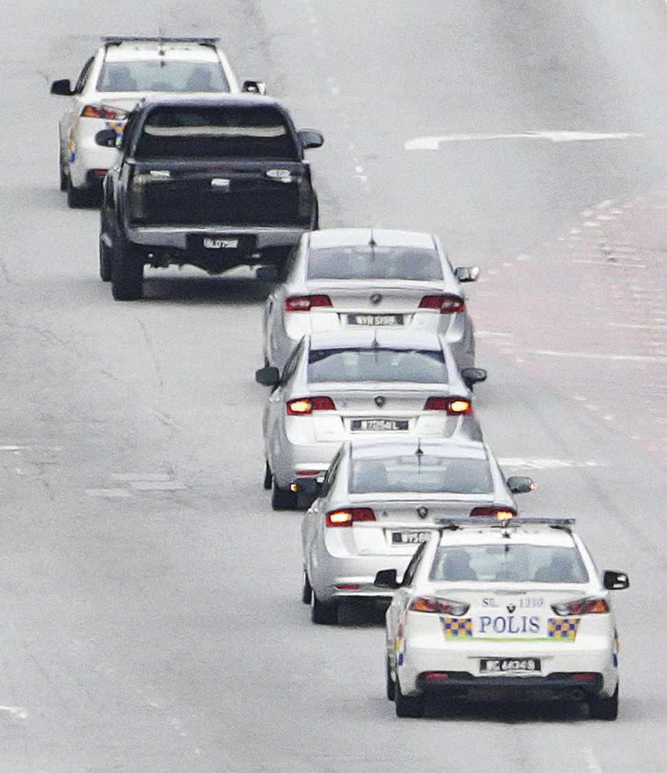 A police convoy, carrying North Korean Ri Jong-chol, leaves the Sepang District Police headquarters in Sepang, Malaysia. Photo: EPA
