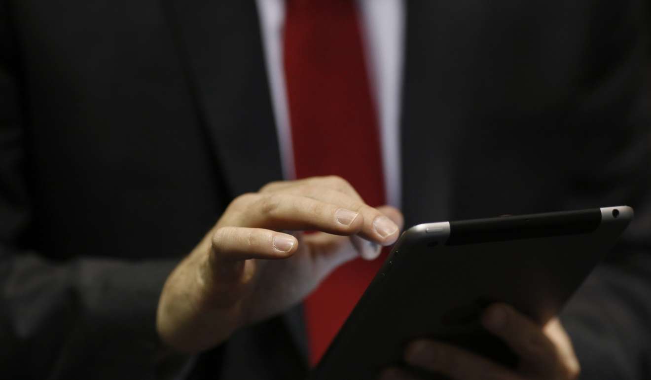 A recruiter uses an Apple iPad during a Job News USA career fair in Overland Park, Kansas. US jobless benefits rebounded last week from a 44-year low, returning to a range that shows strength in the labour market. Photo: Bloomberg