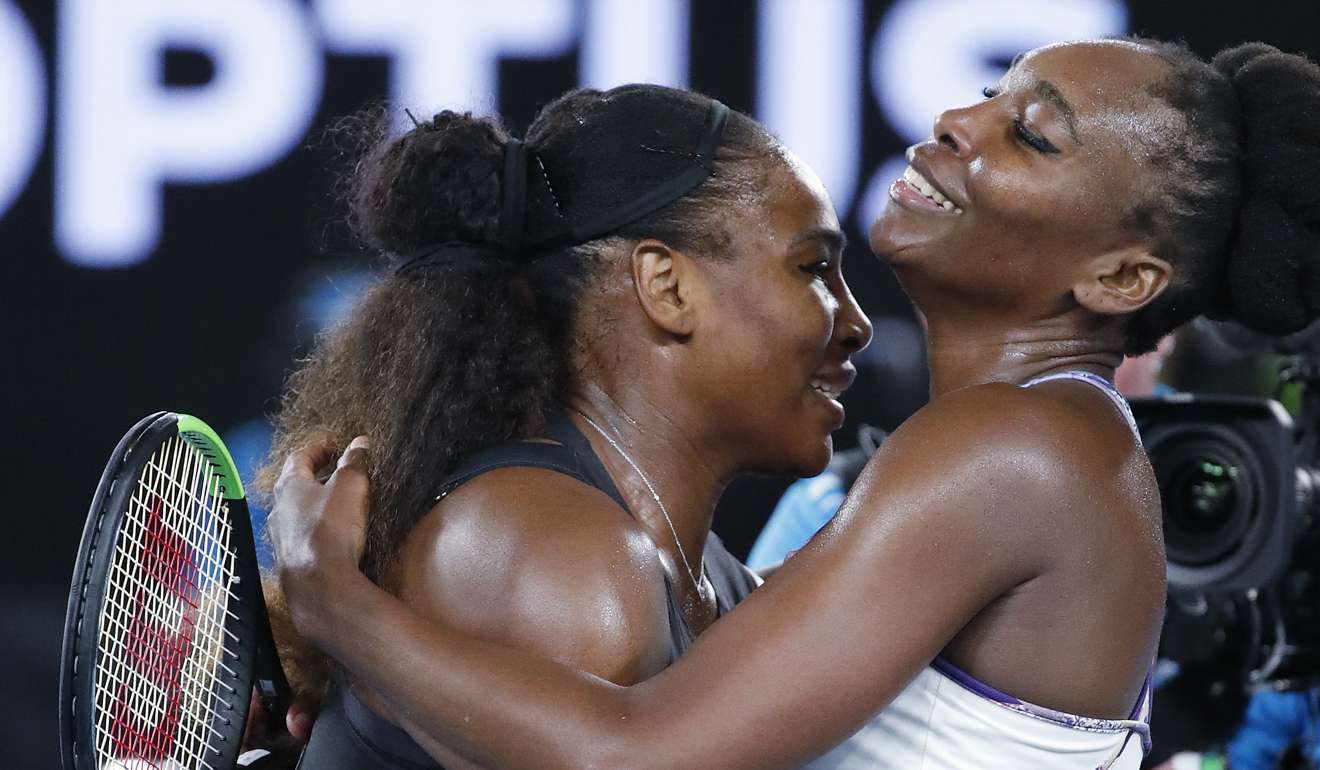 Serena Williams, left, embraces her sister, Venus, as she celebrates after winning the women's singles final at the Australian Open tennis championships. Photo: AP
