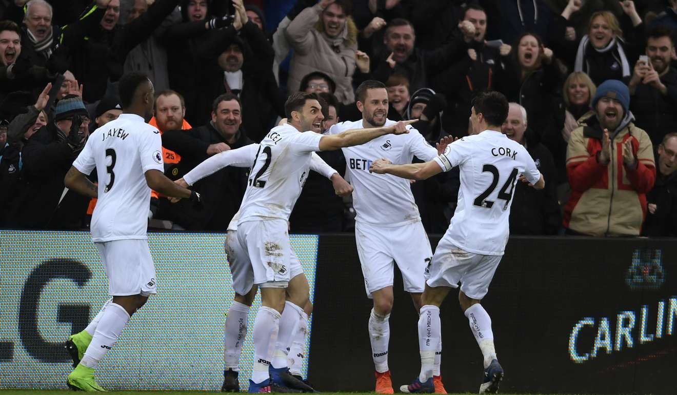 Swansea City celebrate scoring. Photo: Reuters