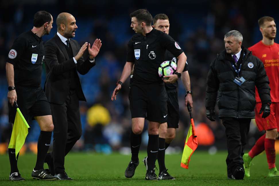 City manager Pep Guardiola confronts the official after the match. Photo: AFP