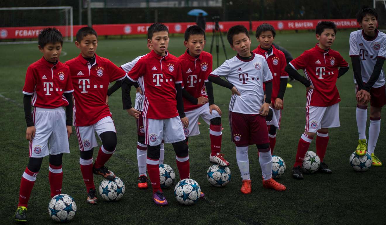 Local player take part in a practice session after the opening ceremony of Bayern Munich’s office in Shanghai.