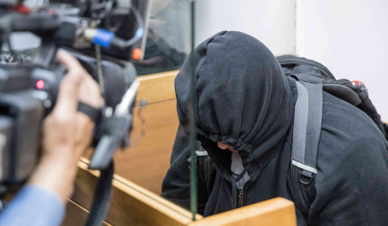 The father of an American-Israeli Jewish teenager, accused of making dozens of anti-Semitic bomb threats in the United States and elsewhere, sits with his face covered in the Israeli Justice court in Rishon Lezion on Thursday. Photo: AFP