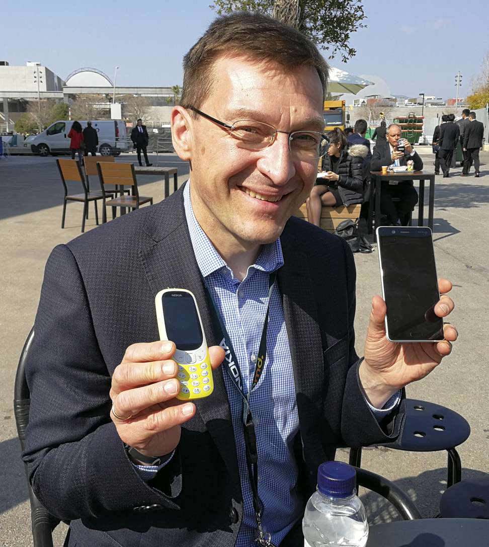 Pekka Rantala, HMD Global’s chief marketing officer, with the Nokia 3310 (left) and Nokia 3 (right) at the Mobile World Congress. Photo: Ben Sin