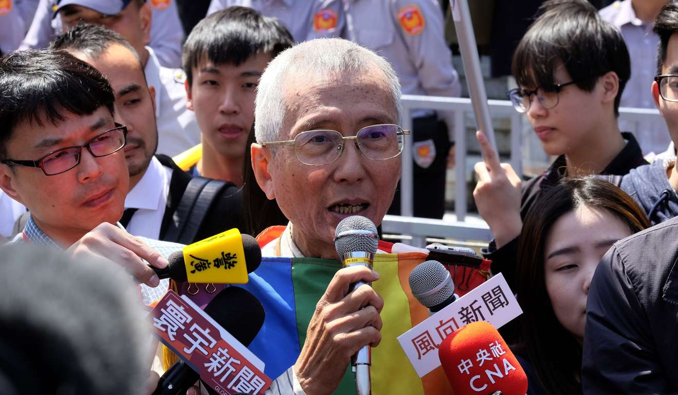 Veteran gay rights activist Chi Chia-wei, centre, speaks to the press in front of the Judicial Yuan in Taipei on Friday. Photo: AFP