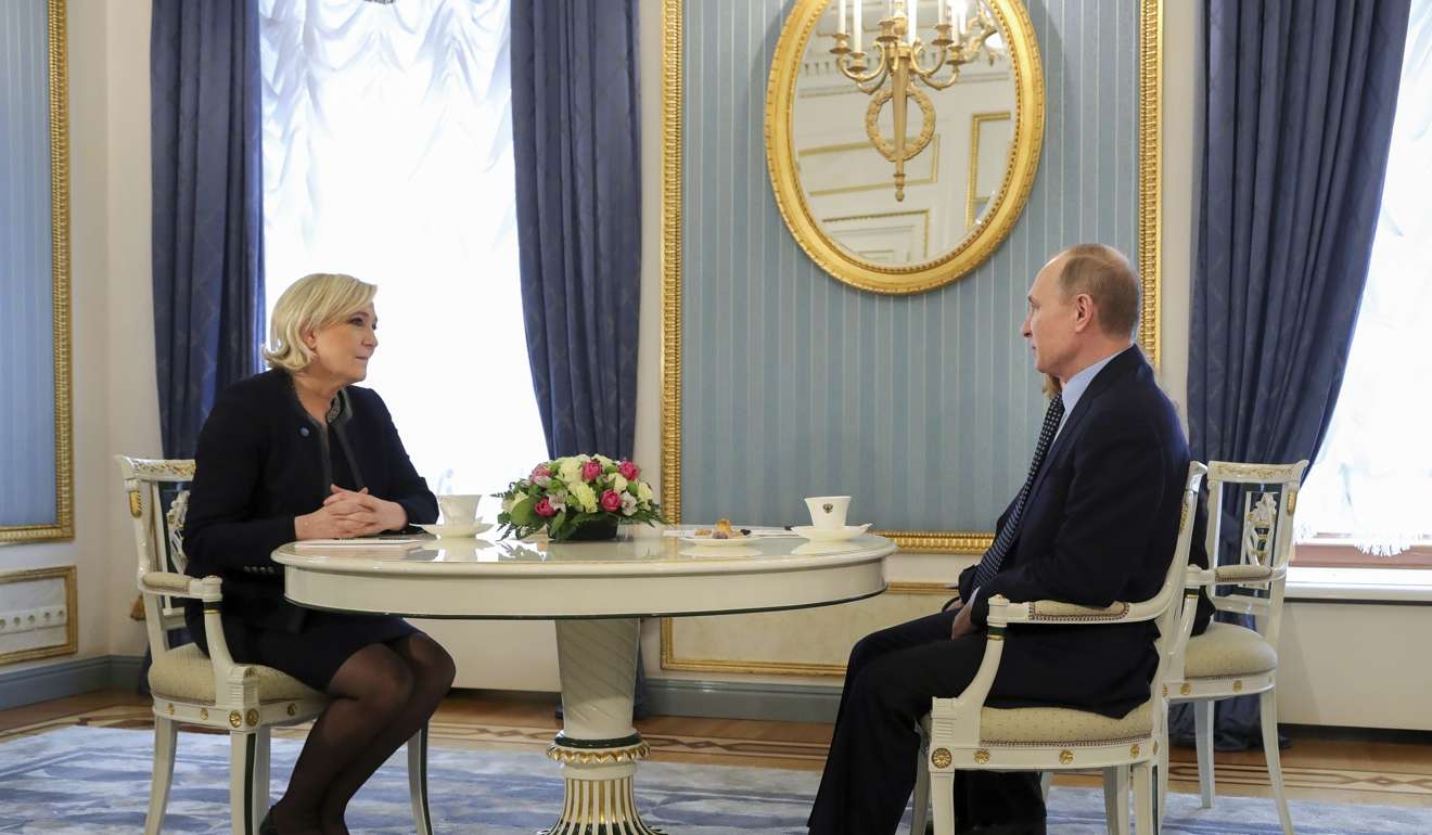 Russian President Vladimir Putin, right, speaks to French far-right presidential candidate Marine Le Pen, in the Kremlin. Photo: AP