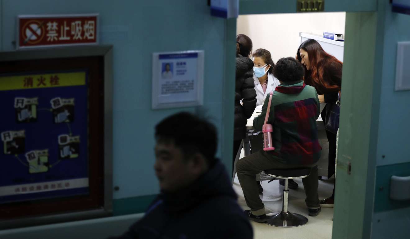 Dr Zhao Limei, a pulmonary specialist, attends to patients at the Jingdong Zhongmei private hospital in Yanjiao. Photo: AP