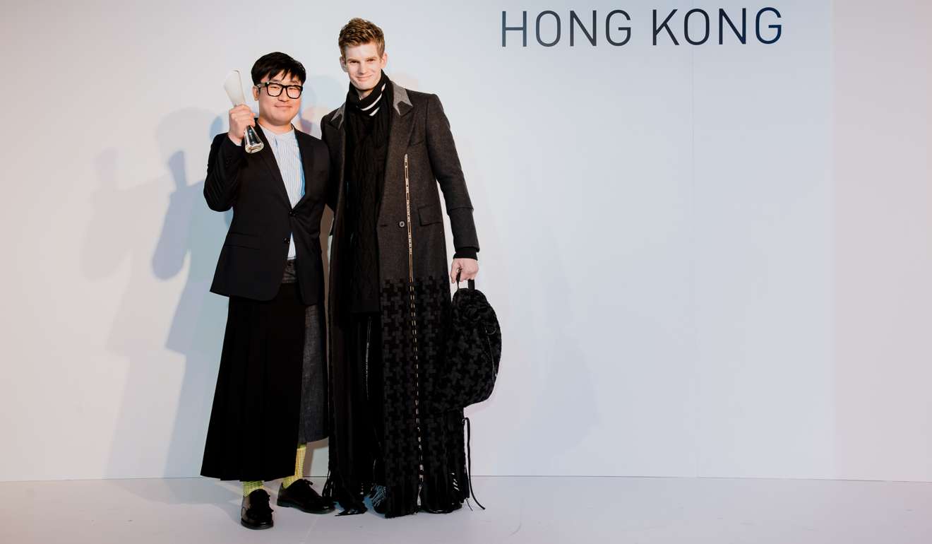 Menswear winner Hyun-min Han (left) who works with brand Munn, on stage at the International Woolmark Prize in Hong Kong in 2016