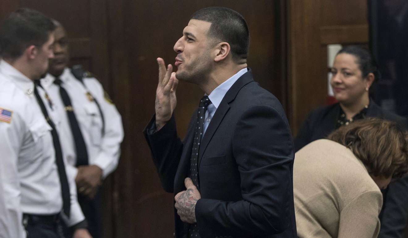 Former New England Patriots tight end Aaron Hernandez blows a kiss to his daughter, who was sitting with her mother, Shayanna Jenkins, who was Hernandez's long-time fiancée, during jury deliberations in his double-murder trial at Suffolk Superior Court in Boston.