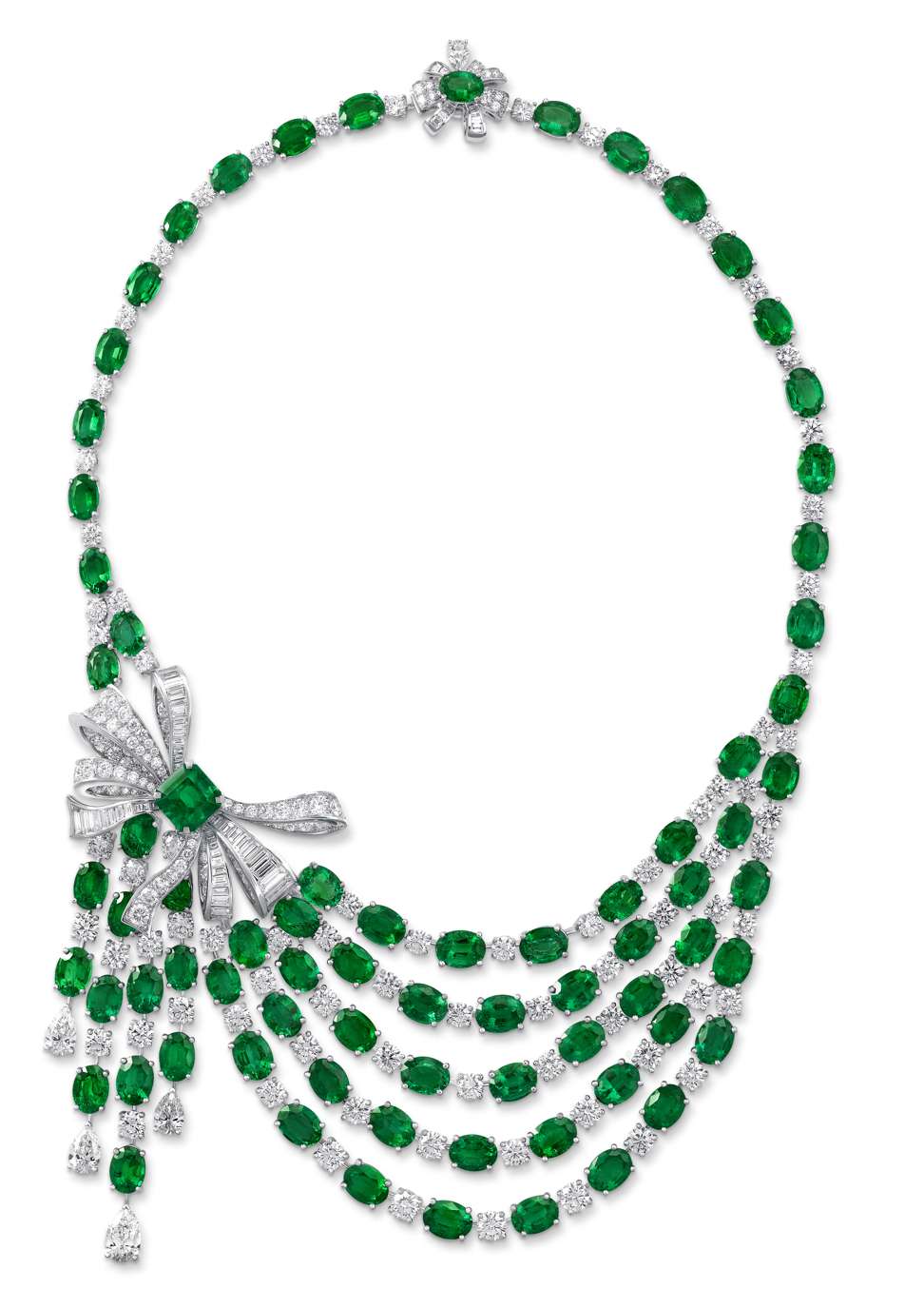 Draping chains of emeralds and diamonds are elegantly joined by a bow on one side of the necklace. Price on request