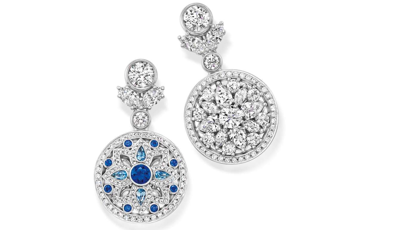 The centrepieces of the earrings are reversible to show either the white diamonds or the aquamarines and sapphires. Price on request