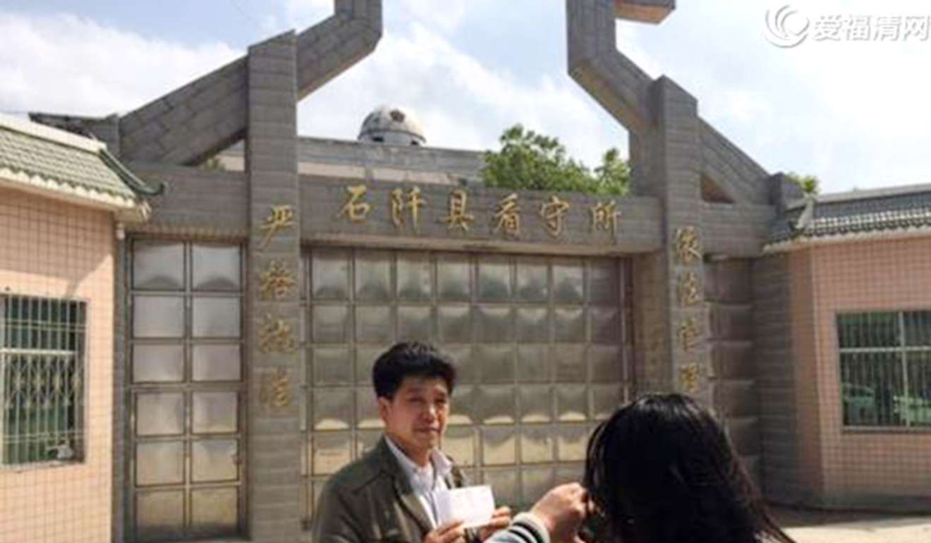 Chen's father shows documents to a reporter during his son’s trial. Photo: Handout