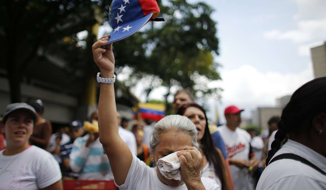 Venezuelans March In ‘silent Protest’, Wearing White To Demand ...