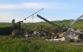 This image reportedly shows the remains of the downed Azerbaijan's Mi-24 helicopter in a field in Armenian-seized Azerbaijani region of Nagorny Karabakh after clashes between Armenian and Azeri forces. Photo: AFP