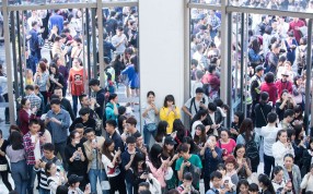 People grab virtual red envelopes with their mobile phones during an augmented reality event held by Alibaba ahead of Singles’ Day, at a shopping mall in Hangzhou. Photo: Reuters