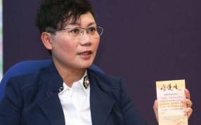 Irene Ho holds one of the new cards, which she stressed were not to prove mental illness. Photo: Xiaomei Chen