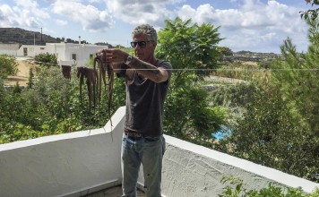 Anthony Bourdain in Greece stringing up fresh octopus Naxian style to dry out before cooking in Parts Unknown. Photos: courtesy of CNN Anthony Bourdain in Greece stringing up fresh octopus Naxian style to dry out before cooking in Parts Unknown. Photos: courtesy of CNN