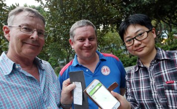 Geoff Scollick (left), Tim Teahan (centre) and Sophia Wong during a geocaching session in Kowloon Tong. Photo: David Wong