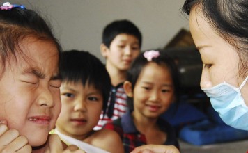 A pupil receives a vaccine injection at a school in Chenzhou, Hunan province. Photo: Reuters