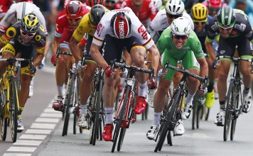 Britain's Mark Cavendish, wearing the best sprinter's green jersey, digs deep to beat Germany's Andre Greipel in the third stage of the Tour de France in Angers. Photo: AP