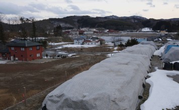 Piles of radiation-contaminated waste sit in a field in the abandoned town of Iitate, on March 3, 2013. Picture: AP