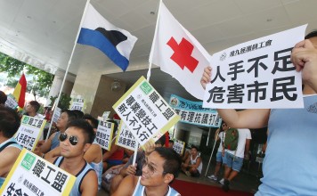 Lifeguards protesting for a better deal outside the headquarters of the Leisure and Cultural Services Department. Photo: David Wong