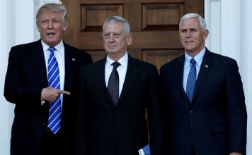 US president-elect Donald Trump (left) and vice-president-elect Mike Pence (right) greet retired General James Mattis in Bedminster, New Jersey, on Saturday. Photo: Reuters