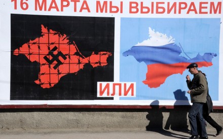 A man walks past a poster setting out a stark Crimean referendum choice in Sevastopol. Photo: AFP A man walks past a poster setting out a stark Crimean referendum choice in Sevastopol. Photo: AFP