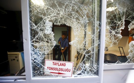 Workers clean up after the Thai consulate in Istanbul had its windows smashed and offices ransacked. Photo: Reuters Workers clean up after the Thai consulate in Istanbul had its windows smashed and offices ransacked. Photo: Reuters
