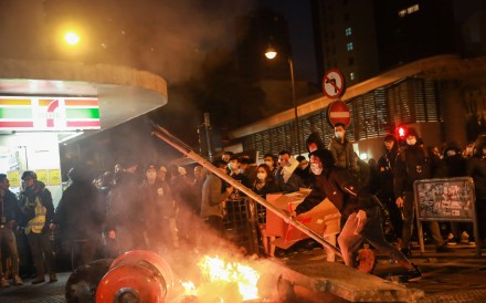 Rioters set fires and threw bricks at police in Hong Kong on the first night of Chinese New Year holiday. Photo: Bloomberg