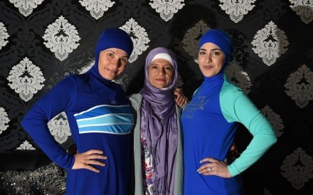 Models clad in burkini swimsuits pose with Australian-Lebanese designer Aheda Zanetti in western. Photo: AFP Models clad in burkini swimsuits pose with Australian-Lebanese designer Aheda Zanetti in western. Photo: AFP
