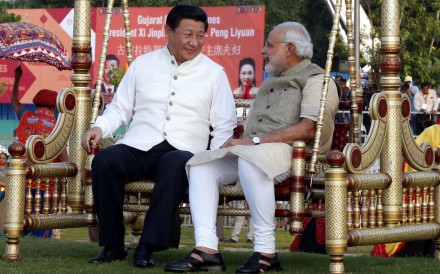Chinese President Xi Jinping sits on a swing with Indian Prime Minister Narendra Modi at a riverside park in Gujarat in 2014. Photo: Xinhua