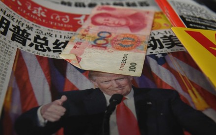 A Chinese newspaper headlined ‘President Trump shakes America’ on sale in Beijing. Photo: AFP