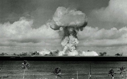 The mushroom cloud of an atom bomb rises among abandoned ships in Bikini lagoon, Marshall Islands, on July 1, 1946. Photo: AP
