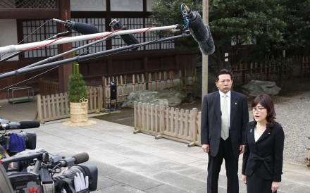 Japanese Defence Minister Tomomi Inada speaks to reporters after visiting the war-linked Yasukuni Shrine in Tokyo. Photo: Kyodo