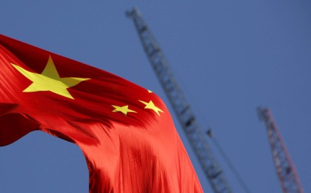 China’s national flag flies near a construction site in Beijing. Photo: Reuters