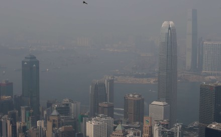 Haze blankets iconic buildings along Hong Kong’s Victoria harbour on January 8. Photo: David Wong