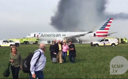 Plane bursts into flame at Chicago airport