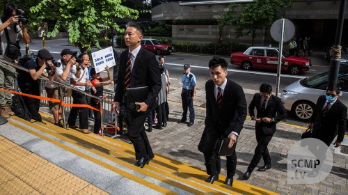 Seven Hong Kong policemen accused of beating up protester appear in court 
