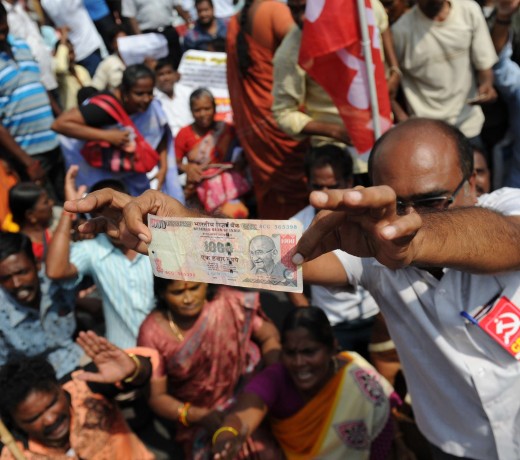A member of the Communist Party of India displays a 1000 rupee note during a protest against Indian Prime Minister Narendra Modi and the withdrawal of the high-value banknotes from circulation. Photo: AFP/Arun Sankar A member of the Communist Party of India displays a 1000 rupee note during a protest against Indian Prime Minister Narendra Modi and the withdrawal of the high-value banknotes from circulation. Photo: AFP/Arun Sankar